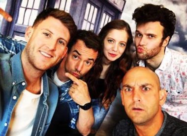 The Monsters and Monks Panel having a photo together in the studio